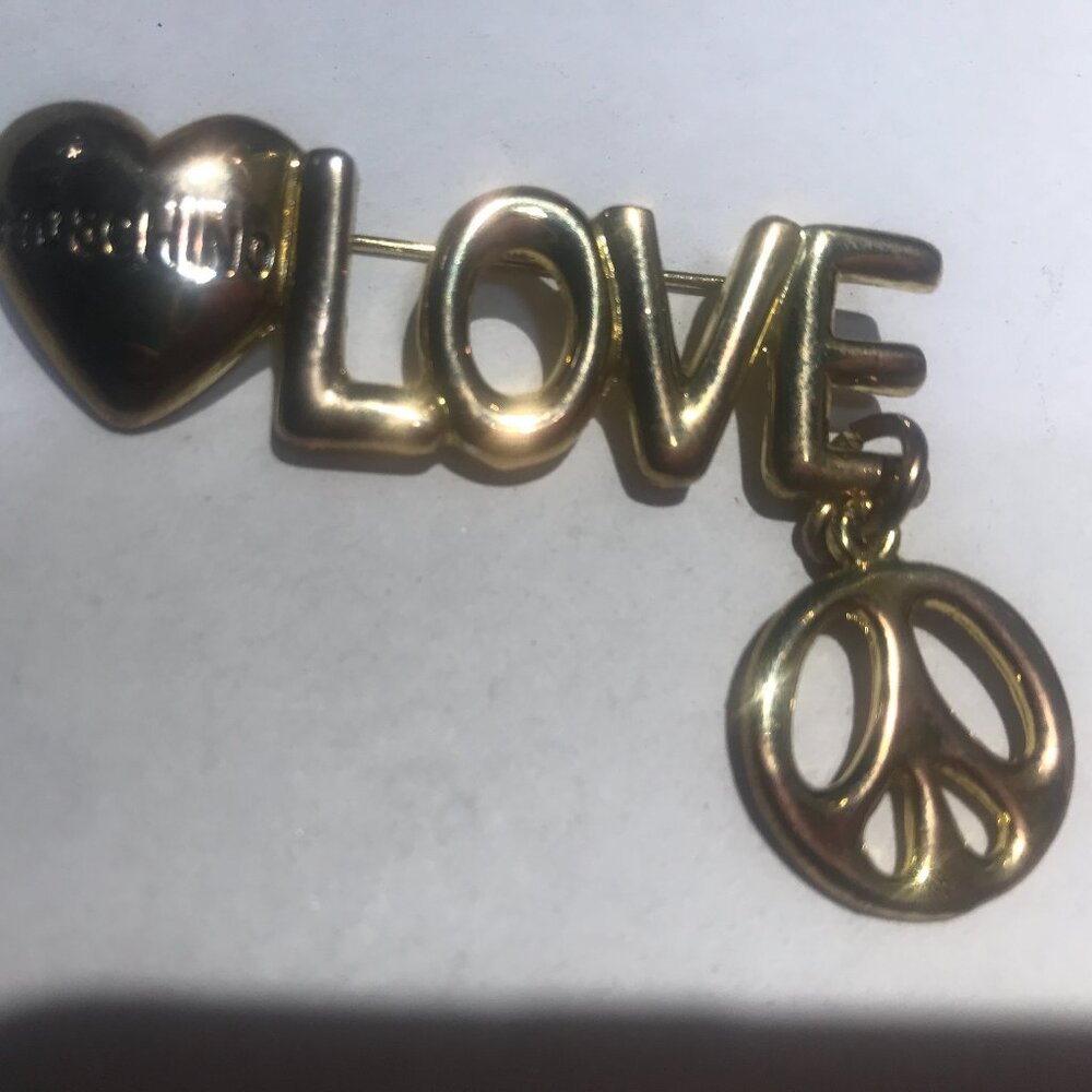 A designer pin. Brass. Vintage 1990's